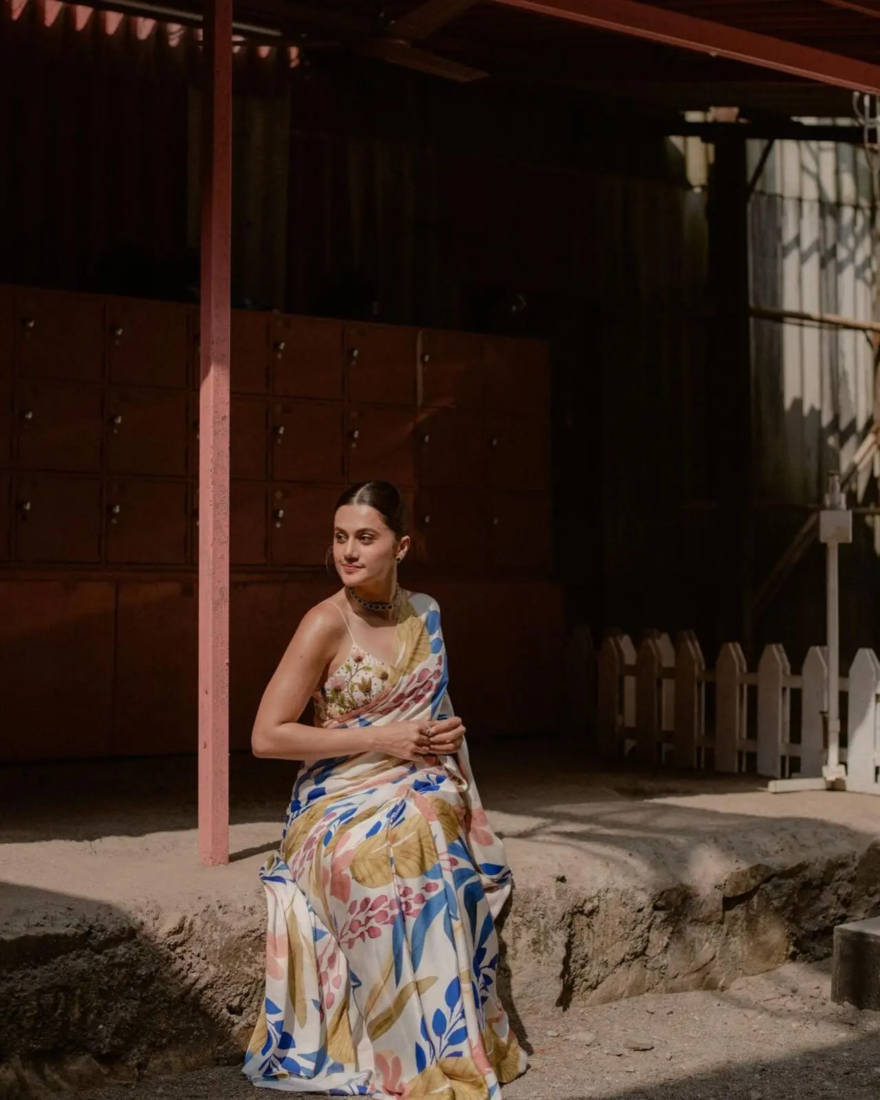 Taapsee looked elegant in a white saree with multicolored prints, making it a must-have for any office wardrobe