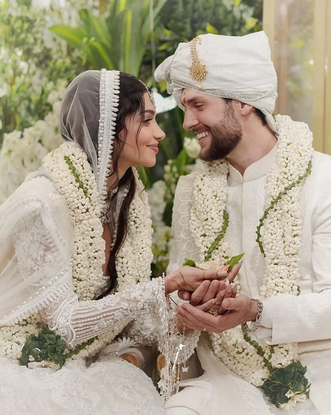 Ananya Panday`s cousin, influencer Alanna Panday, wore a Manish Malhotra lehenga. It was a white handcrafted threadwork lehenga