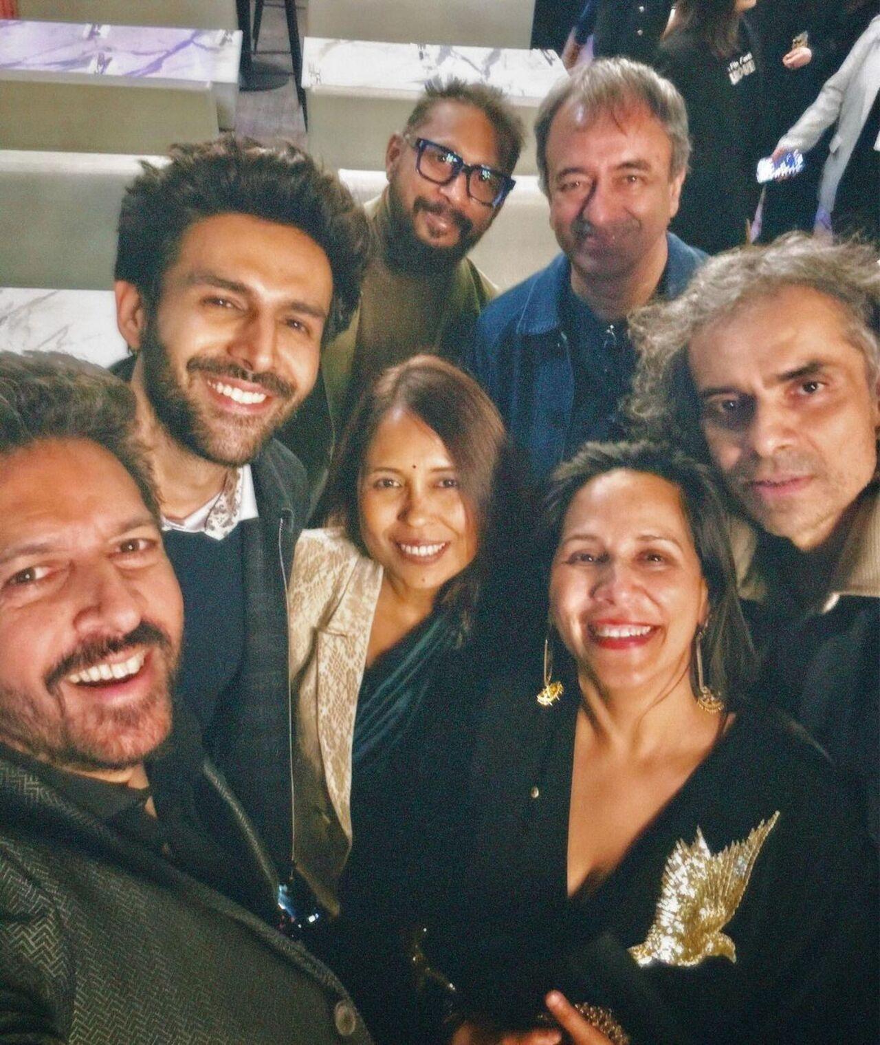 Kartik Aaryan snaps a selfie with filmmakers Kabir Khan, Shoojit Sircar, Rajkumar Hirani, Imtiaz Ali, Rima Das, and Mitu Bhowmick Lange.