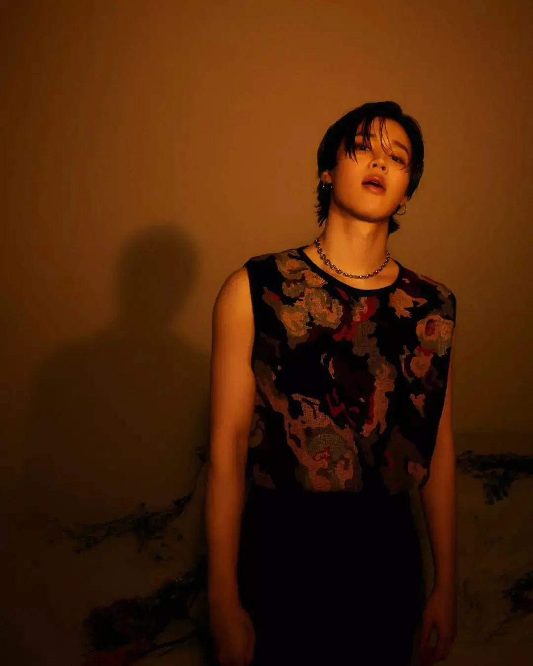 Jimin doesn`t shy away from floral patterns. One memorable photo captured him in a floral top, showcasing a more playful and colorful side to his style.