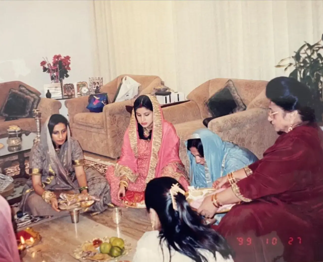 In this picture, a pregnant Maheep can be seen following rituals along with sister-in-law, Sunita Kapoor, mother-in-law, and Varun Dhawan`s mother Laali Dhawan