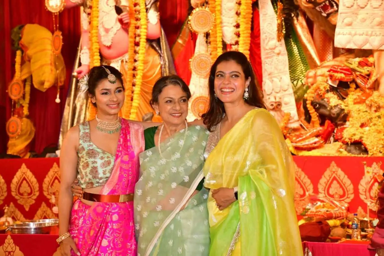 Kajol and Tanishaa posed with their mother Tanuja at their family`s Durga Puja pandal