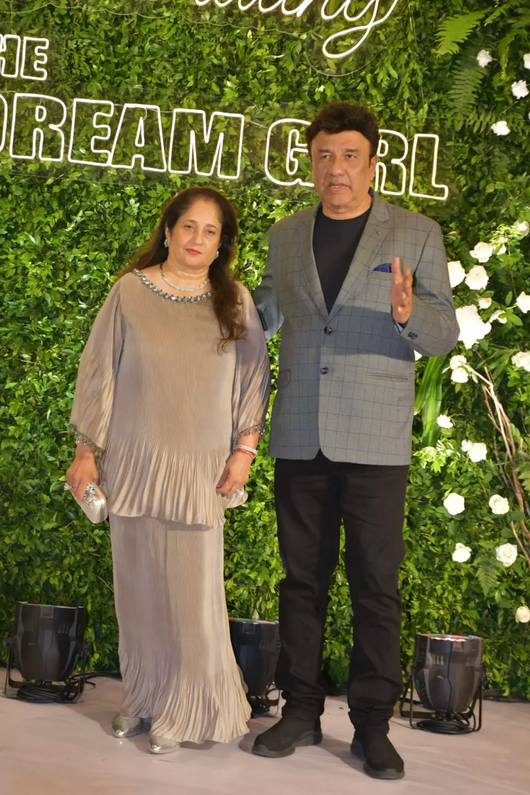 Anu Malik was snapped alongside his wife at Hema Malini`s 75th