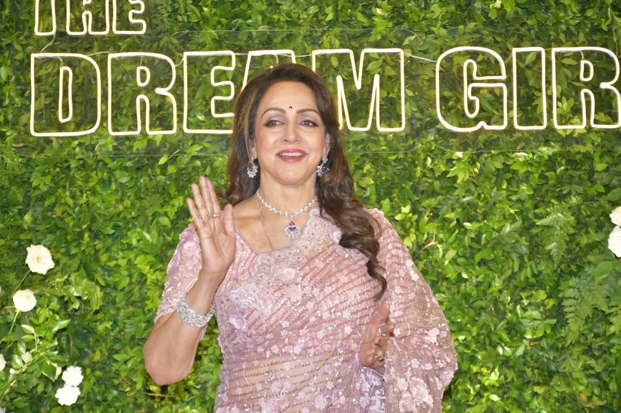 The actress looked gorgeous in a pink lace saree with a statement diamond necklace