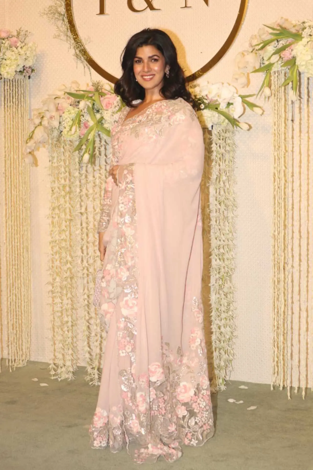 Nimrat Kaur opted for a pink pastel saree with heavy embroidery work at its border. She left her short hair open and flashed a beautiful smile for the paparazzi
