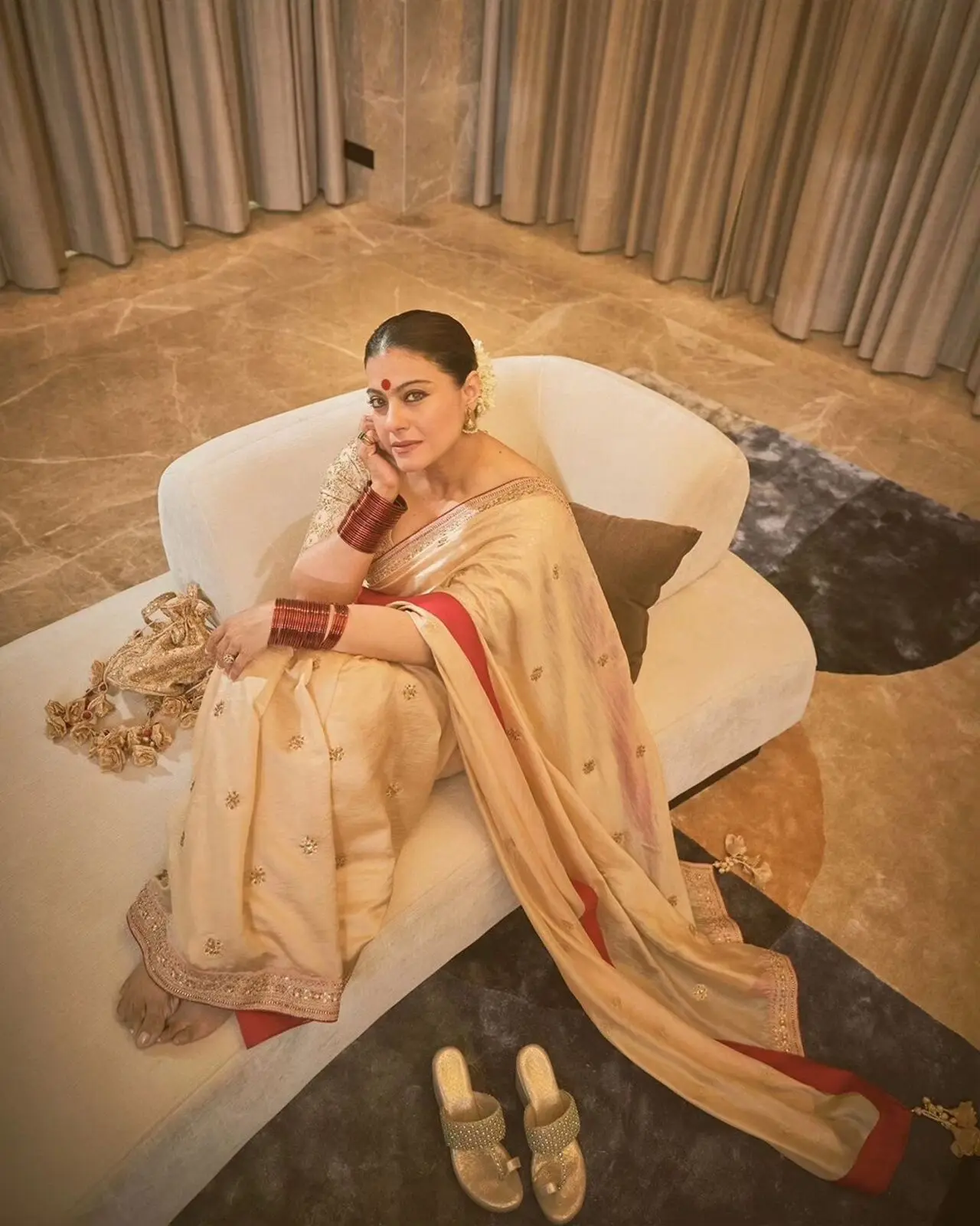 The `My Name Is Khan` actress took to her social media handle to share inside pictures from Navami celebrations. For the occasion, Kajol opted for a golden saree paired with a big bindi and traditional jewellery