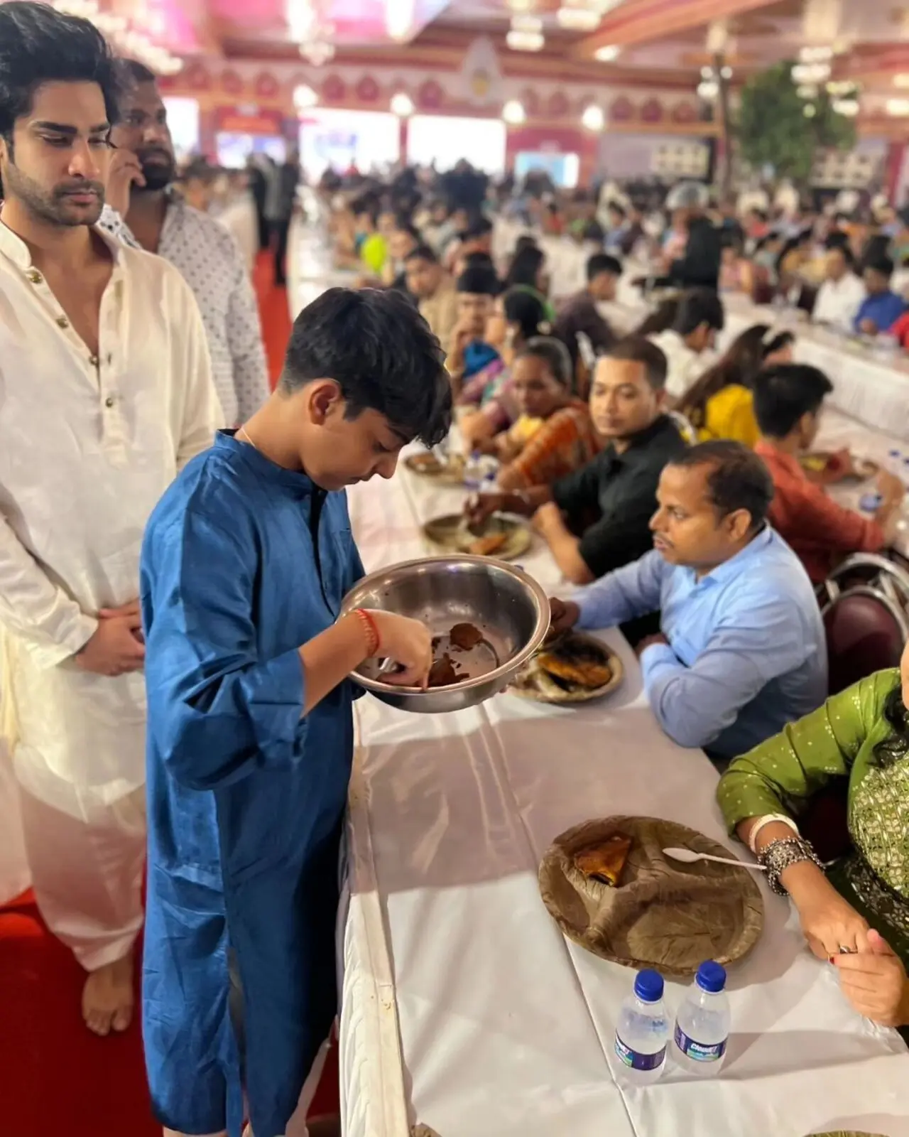 Sharing a picture of Yug serving bhog, Kajol wrote, "Third day . Shubho Navami. And it was an amazing day. My son served at the bhog and understood why I do it every year"