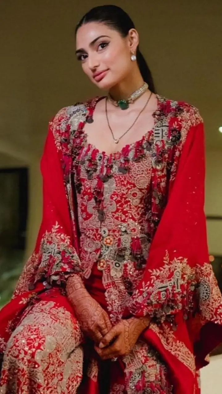 Are you a modern newlywed who prefers comfort and style? Then Athiya Shetty-inspired red printed pants, kurti and jacket are your go-to option