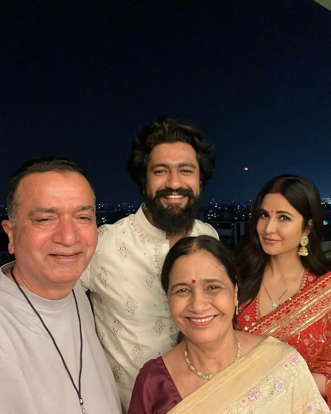 Vicky and Katrina pose with the former`s parents as they all celebrate the festival at their Mumbai home