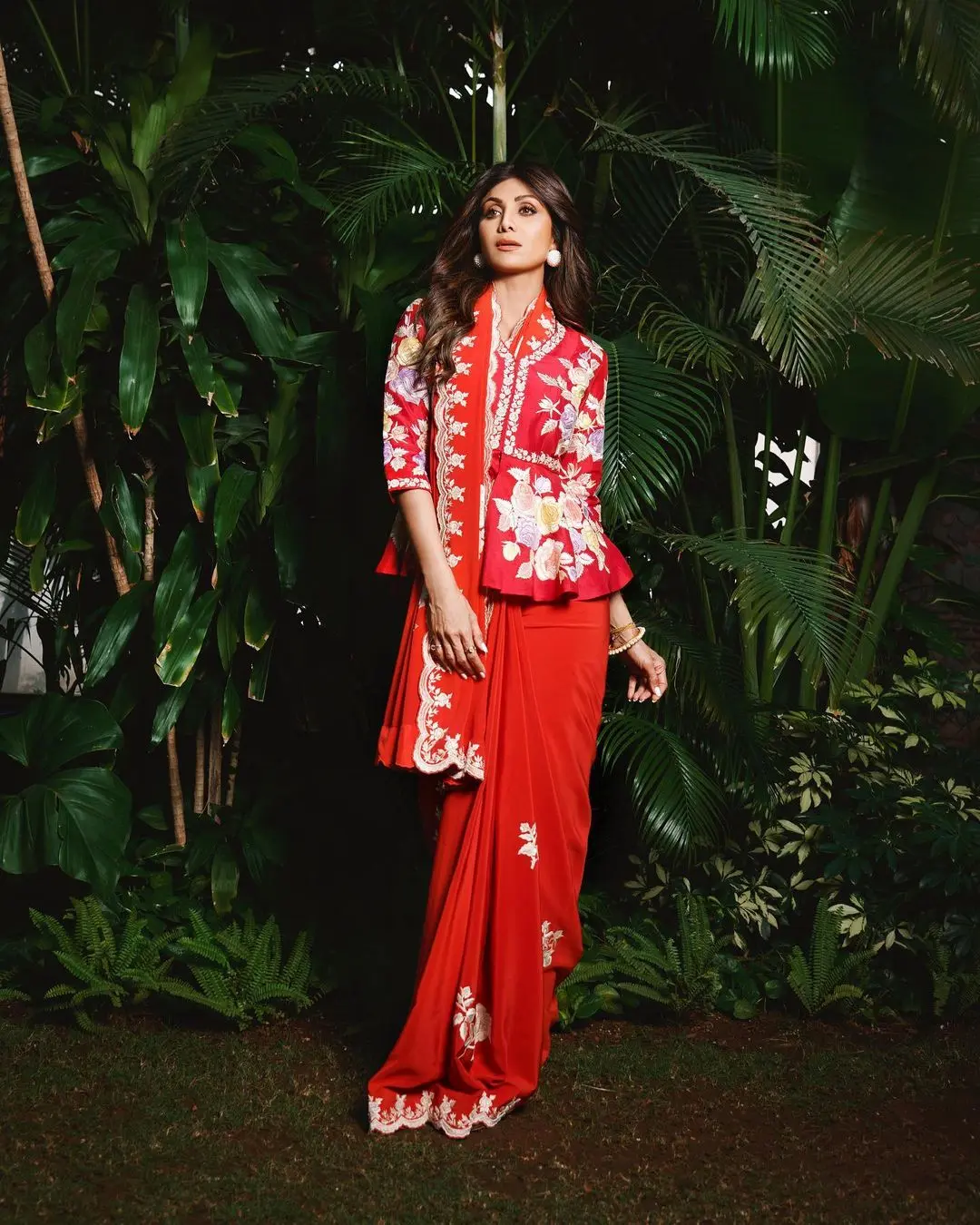 To complete her look, Shilpa chose statement white studs that perfectly complemented her ensemble. The border of the saree featured modern details, giving her appearance a trendy edge.