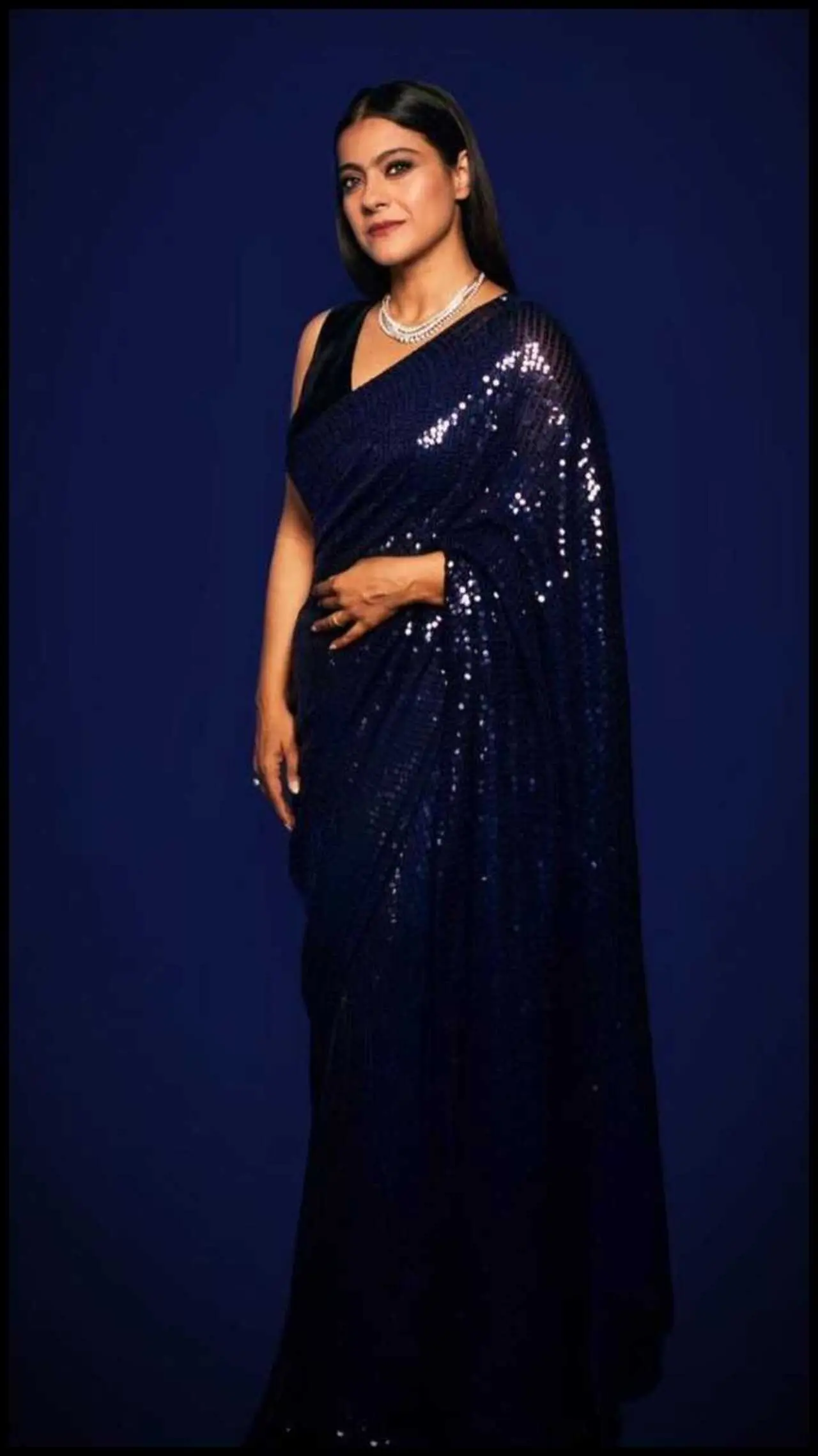 Kajol`s sequined deep blue saree is perfect if you are going for a royal vibe