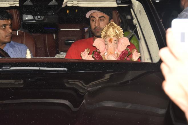 With Lord Ganesha on his arm, Ranbir Kapoor embodies devotion.
