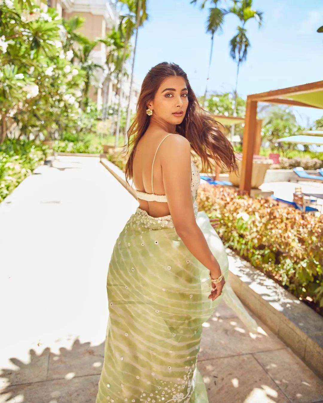 Navratri is all about embracing vibrant colors and beautiful traditional styles. And what better way to make a fashion statement than with a gorgeous saree? Actress Pooja Hegde is a shining example of this.