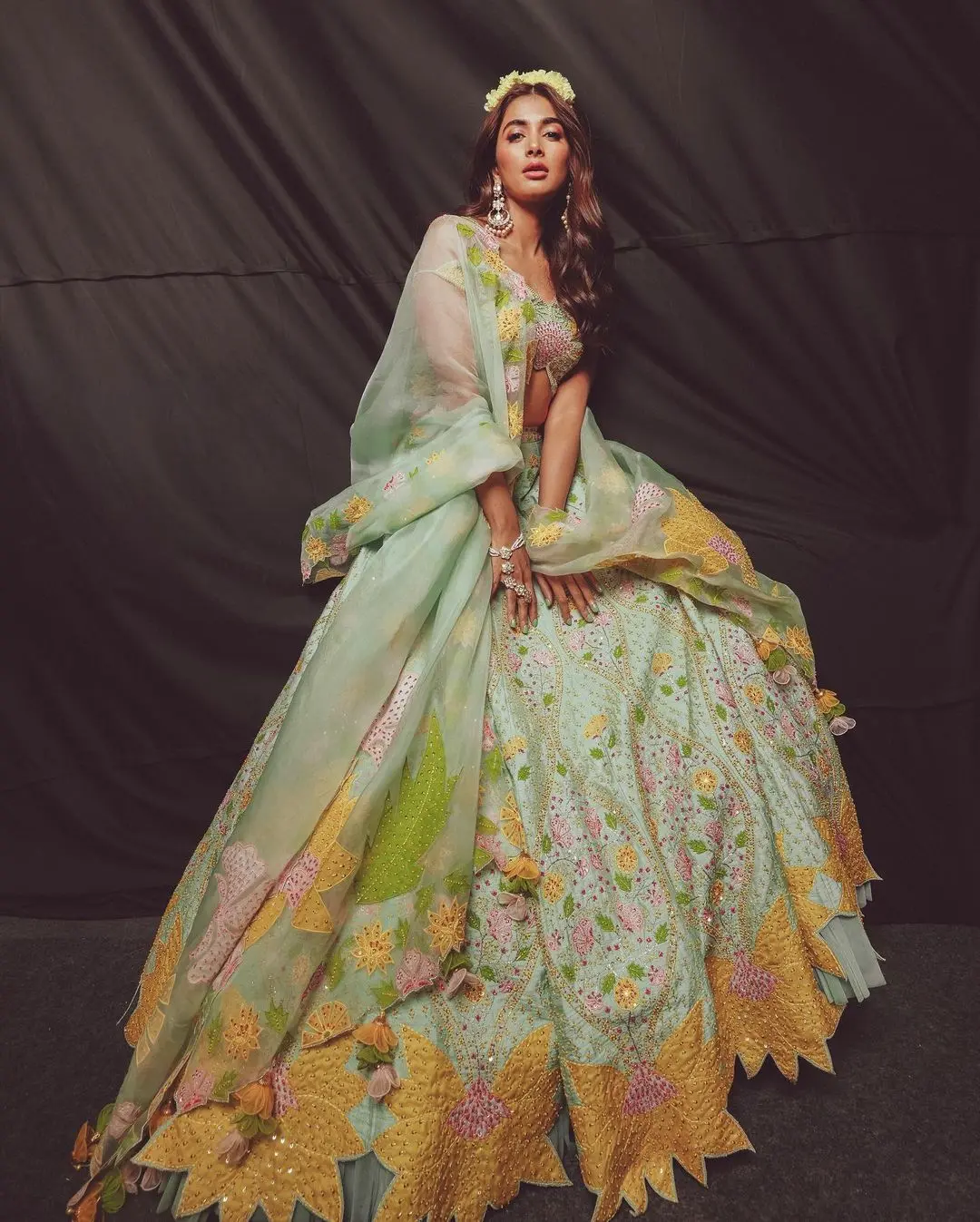 Pooja Hegde`s look was like a breath of fresh air in the rising heat. The Radhe Shyam actress appeared dreamy in her floral lehenga, radiating summer vibes with its lovely colors and flower patterns.
