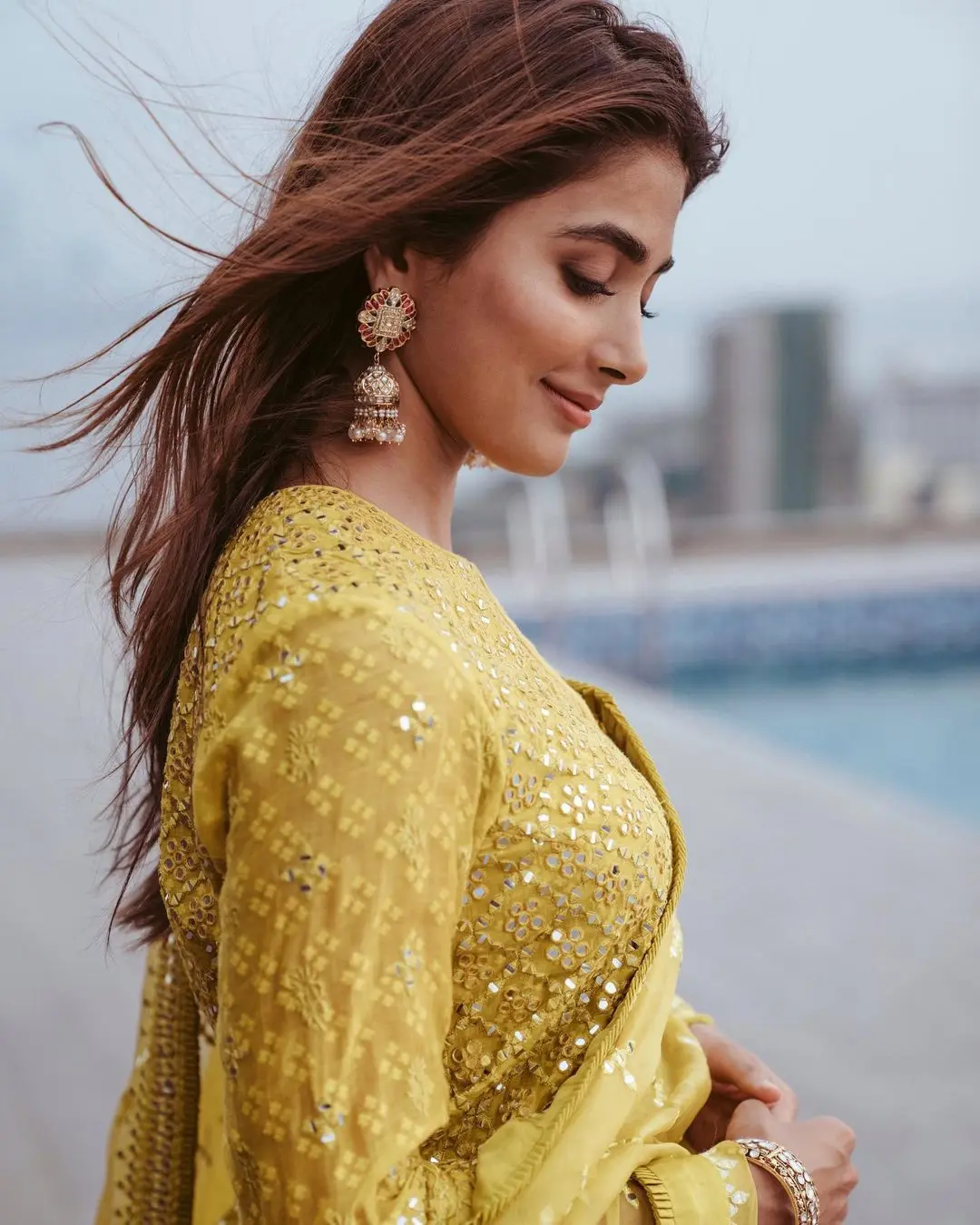 Pooja was the muse for fashion designer Archana Jaju, and she chose an ethnic outfit straight from the designer`s collection. Pooja looked stunning in a vibrant yellow short kurta intricately embroidered with yellow resham threads.