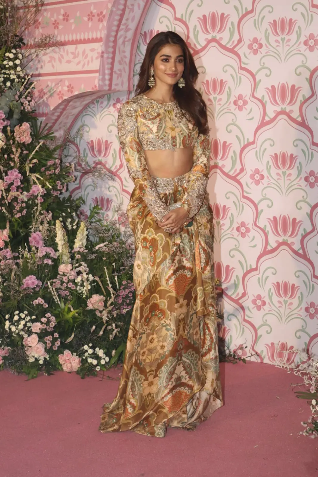 Pooja Hegde upped the glam quotient in this two piece stylish gold lehenga