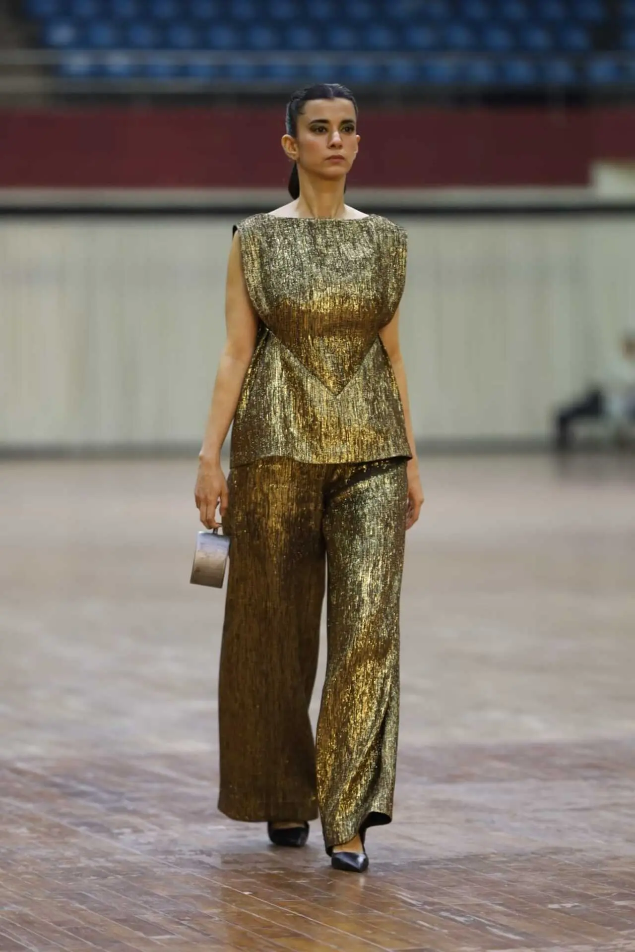 The actress wore flared pants with a peplum-style top