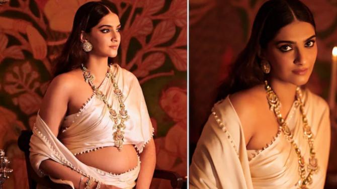 See Photos : Mom To Be Sonam Kapoor Flaunts Her Baby Bump In Royal White Saree