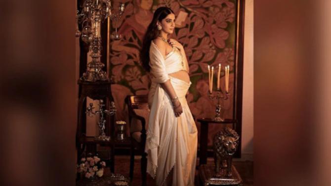 See Photos : Mom To Be Sonam Kapoor Flaunts Her Baby Bump In Royal White Saree