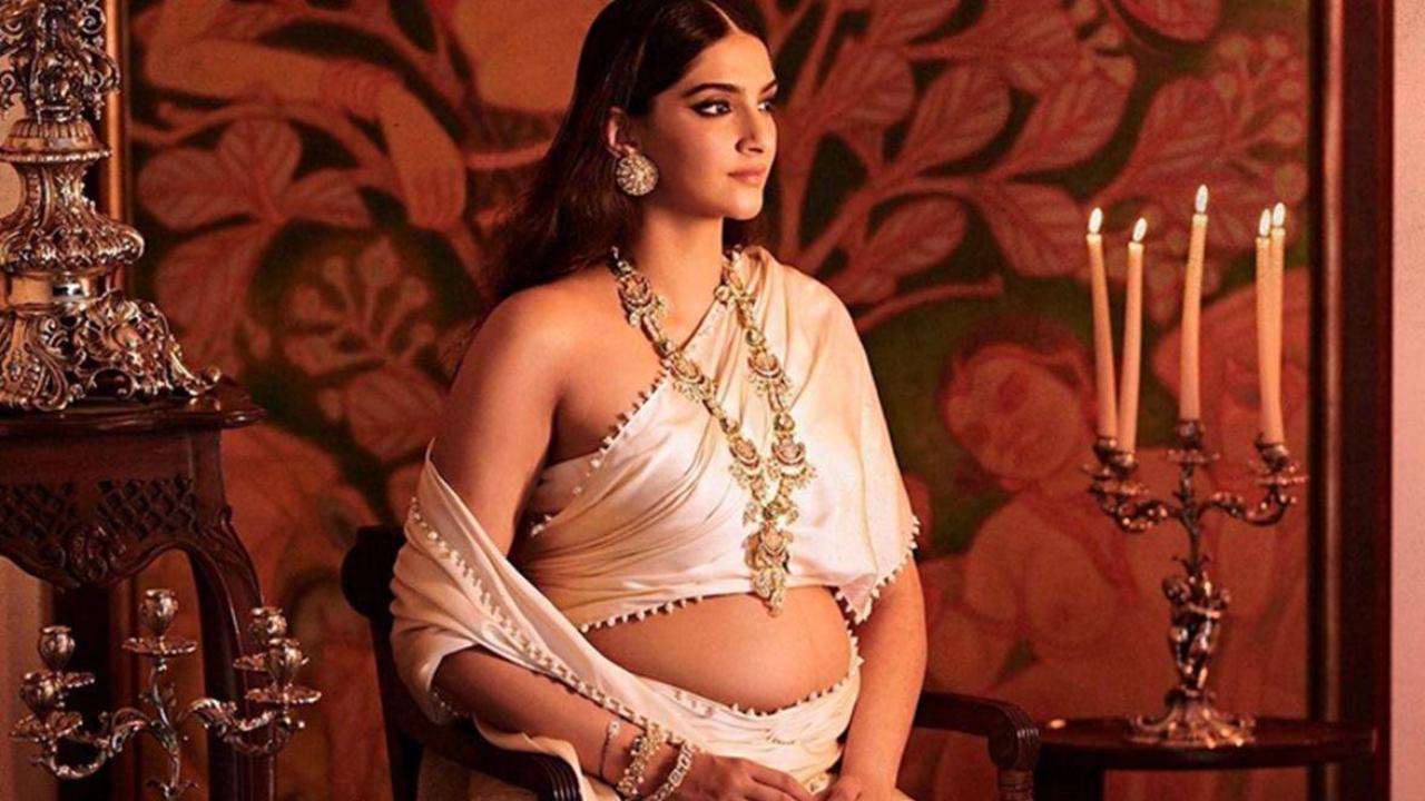 See Photos : Mom To Be Sonam Kapoor Flaunts Her Baby Bump In Royal White Saree