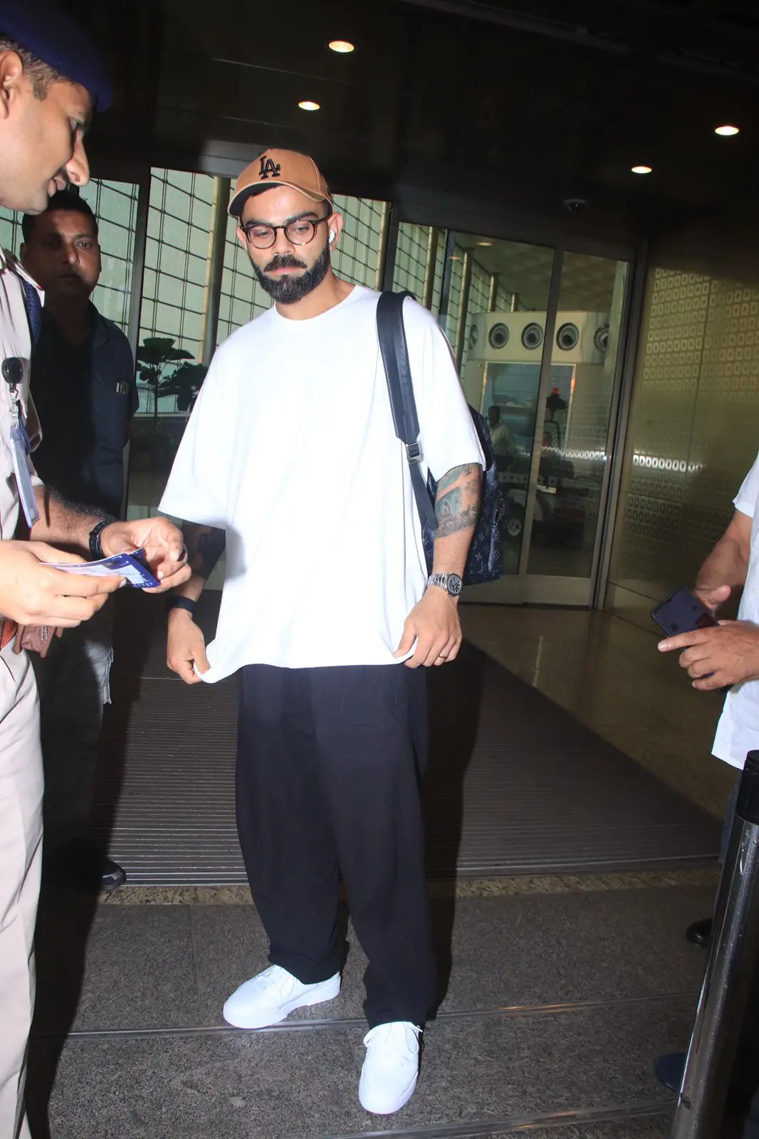 Virat Kohli aced his airport look in a comfy white T-shirt and a black trouser