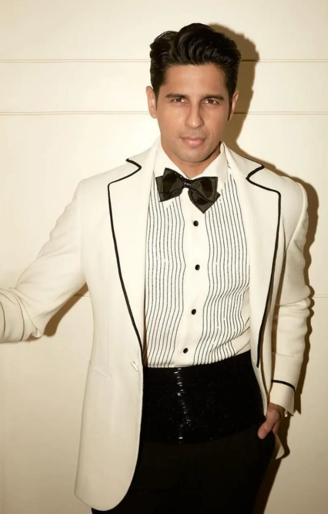  Exudes timeless sophistication in his fashion choices. Whether it`s a classic suit or a casual outfit, Malhotra`s style is marked by refined elegance.