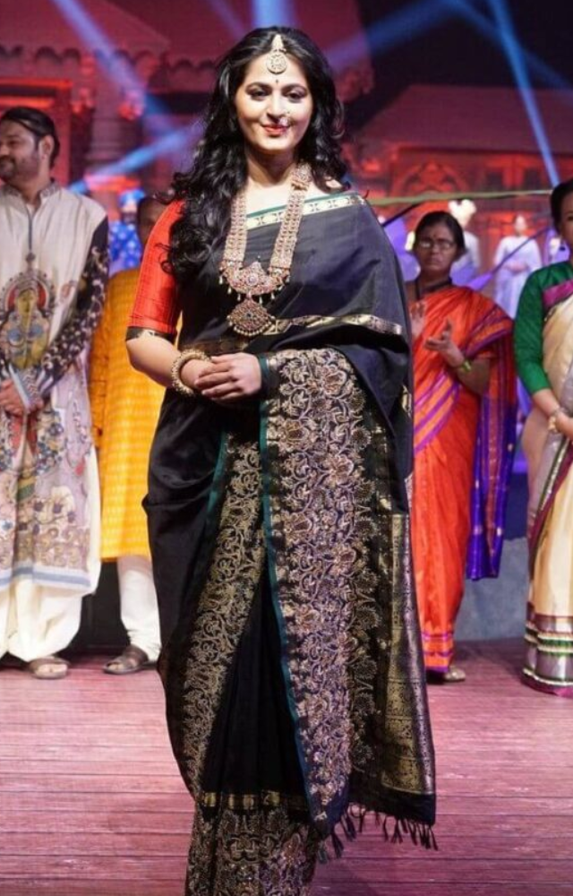 Anushka Shetty`s saree looks are nothing short of regal. Known for her role as Princess Devasena in Baahubali, she often dons rich handloom fabrics.