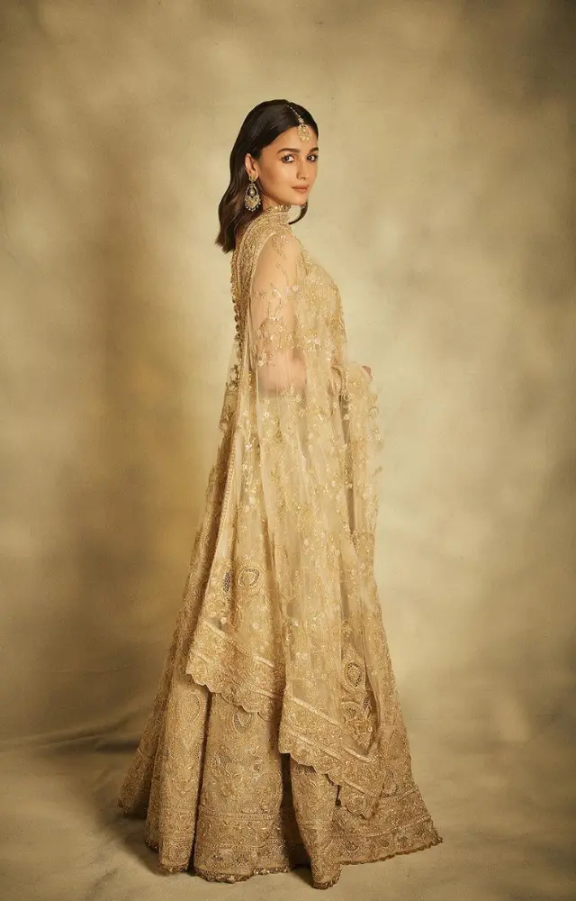 Alia Bhatt wore a golden lehenga by Abu Jani and Sandeep Khosla. She lived up to the glitz and glam for the event.