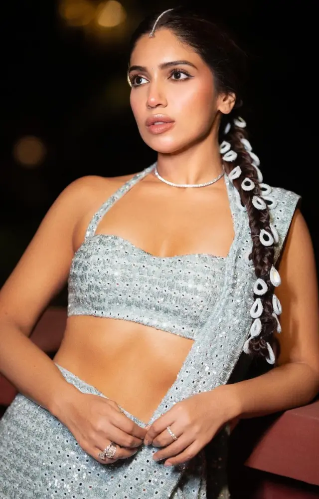 The stylish halter-neck bralette blouse, paired with a sleek diamond choker