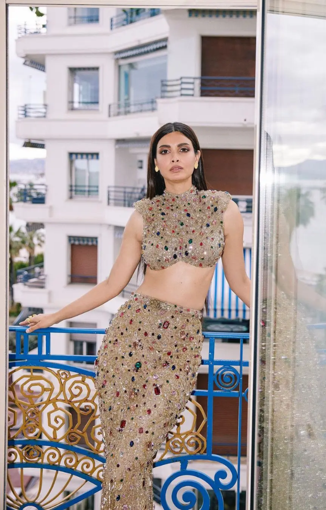 Diana Penty graced the Cannes red carpet in a custom Falguni Shane Peacock golden two piece outfit.