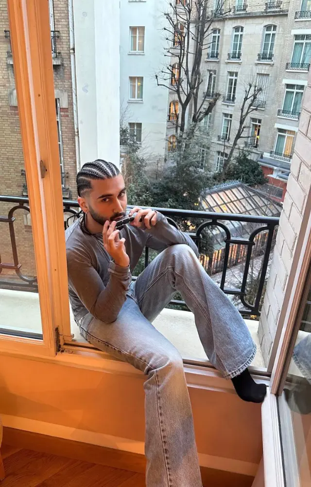 Orry is giving `I`m here for the vibes` as he sits by the window