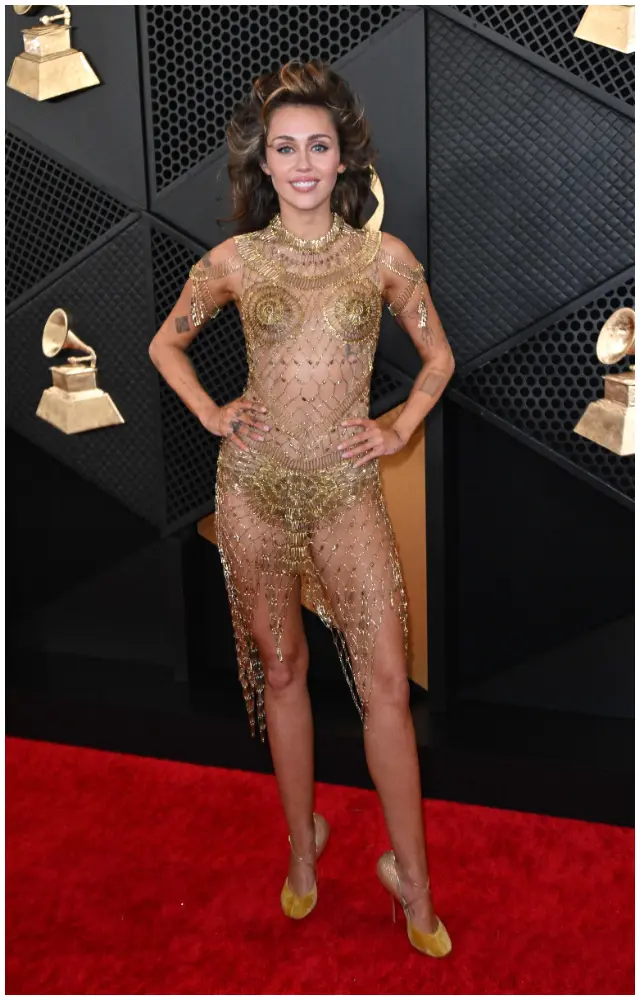 Miley Cyrus wore several show-stopping looks during Grammys 2024. The first was this John Galliano for Maison Margiela couture naked dress on the red carpet