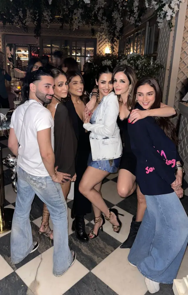 Orry strikes a pose with Malaika Arora, Sussanne Khan and other ladies at the party