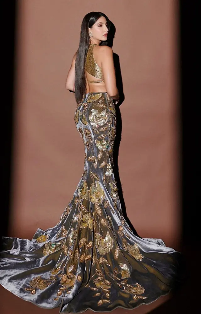 Nora Fatehi exudes confidence and radiance in a stunning golden crop top paired with a fish-tail skirt	