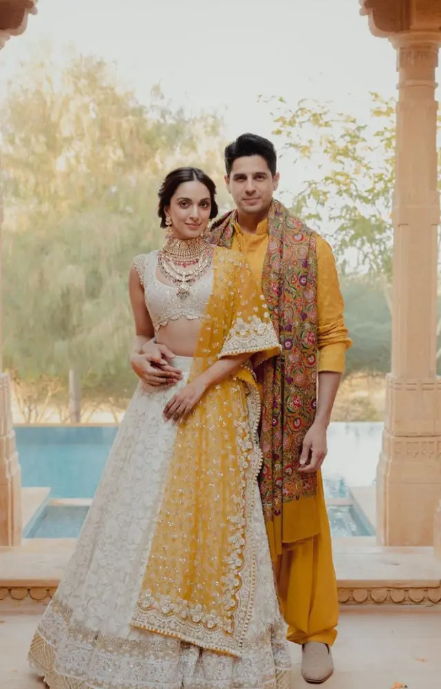 This is a still from their Mehndi, in which they both coordinated the tones of cream and yellow in their outfits. The pair seemed royal in these ensembles