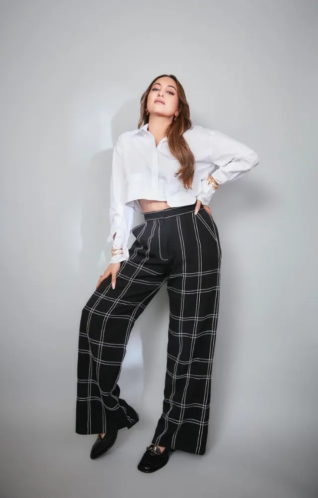Sonakshi Sinha is sporting a stylish trousers and crop shirt ensemble.
