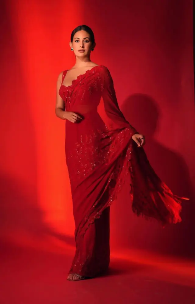 Stealing the spotlight in a striking red sheer saree, Amyra is the girl of our dreams