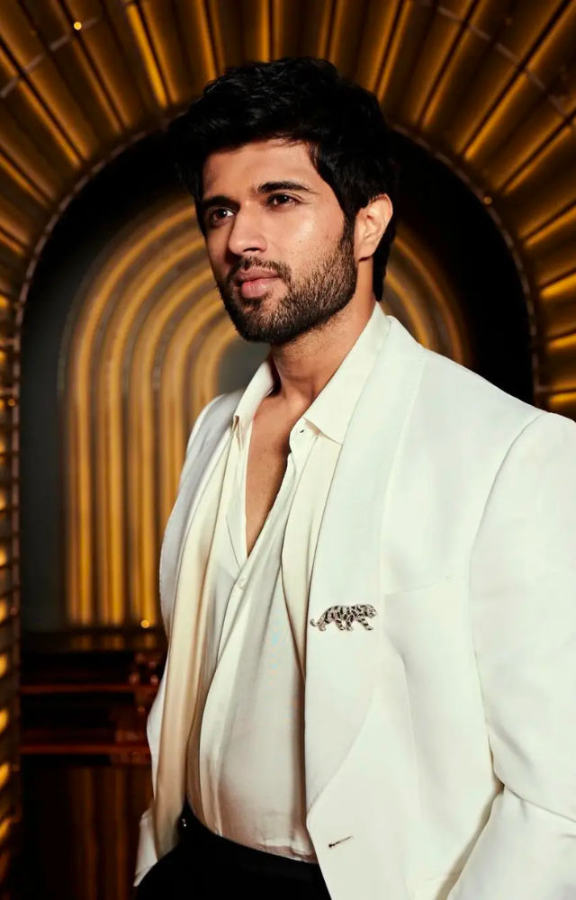 The  `Arjun Reddy` actor looked handsome in a classic white shirt, white blazer, and black pants.