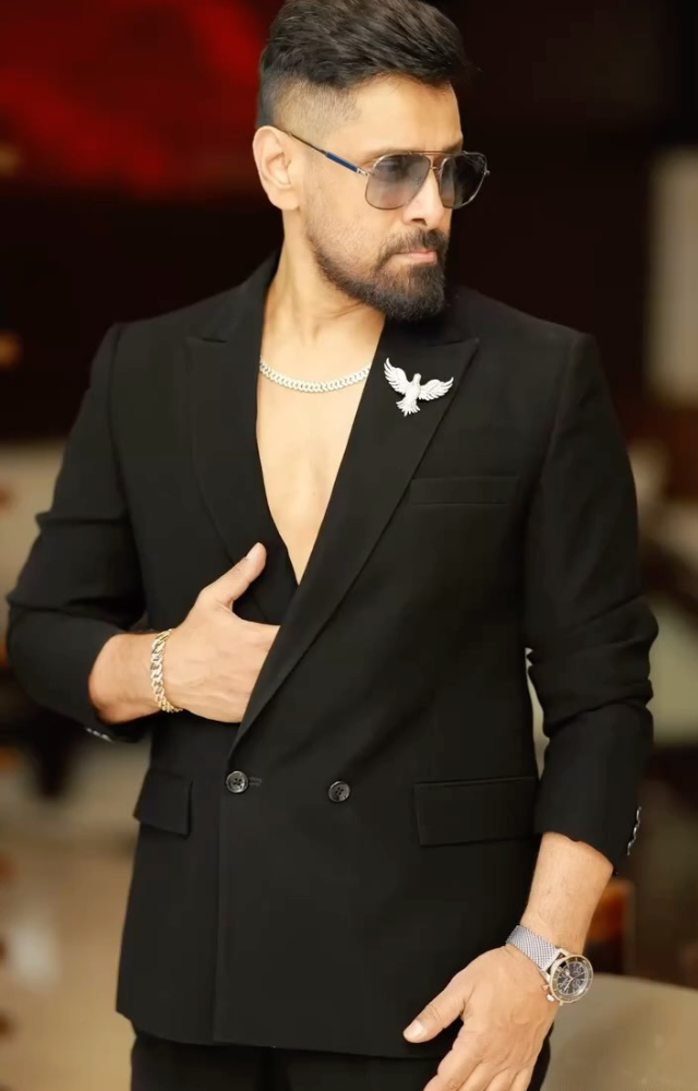 Chiyaan Vikram made a stylish appearance in sleek black attire, complemented by a silver chain, looking both elegant and stylish