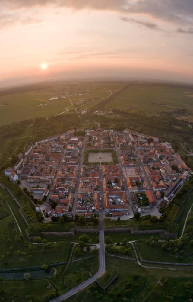 Though not in a lake now, this town was originally surrounded by moats and wetlands, built like an island for defense.
