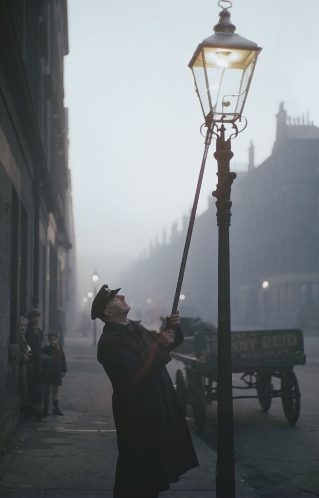 Before electric lights, lamplighters walked city streets each evening to manually light gas lamps.
