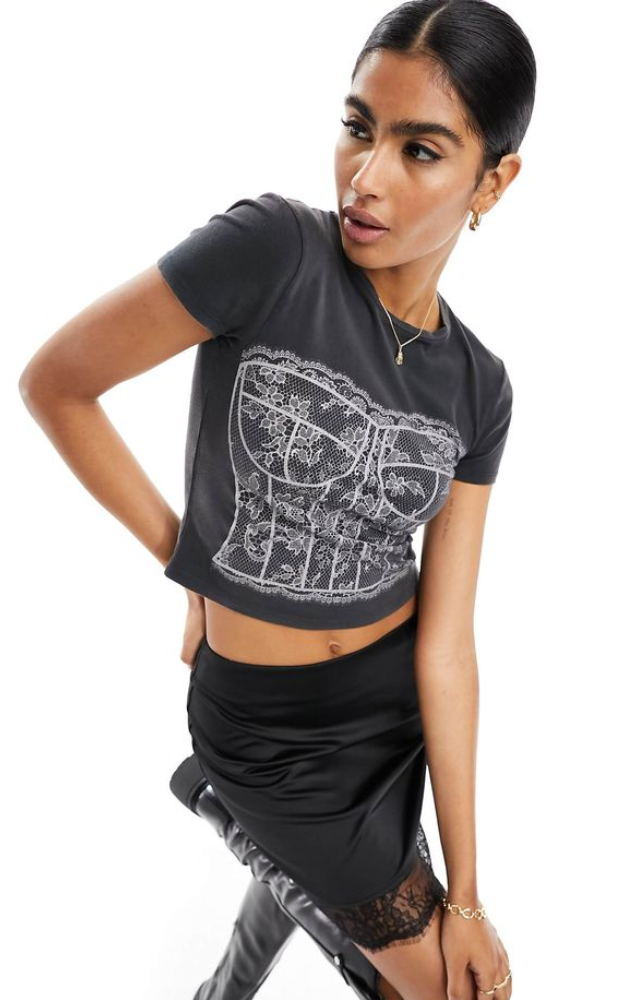 Transform vintage band or logo tees into form-fitting corsets. Add laces, boning, or contrast stitching for a bold couture vibe.
