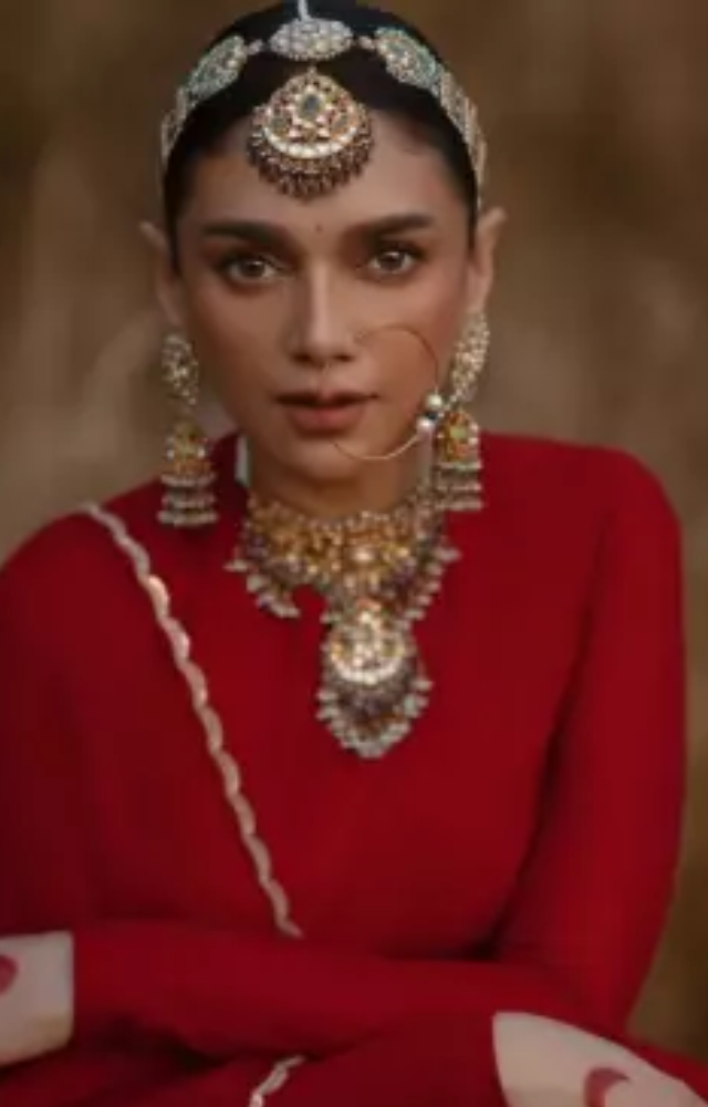 Aditi Rao Hydari looked stunning in a red lehenga designed by Sabyasachi Mukherjee.