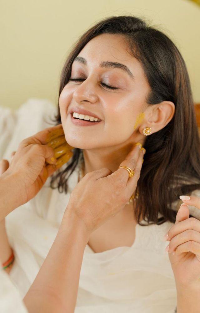 Aishwarya Arjun wore a simple white kurta, and the decor followed a vibrant yellow theme titled Cover Me in Sunshine 