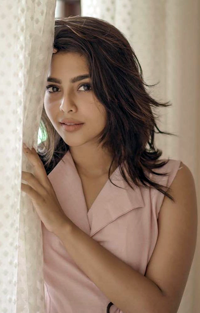 Aishwarya Lekshmi`s new pictures showcase her elegance and grace.