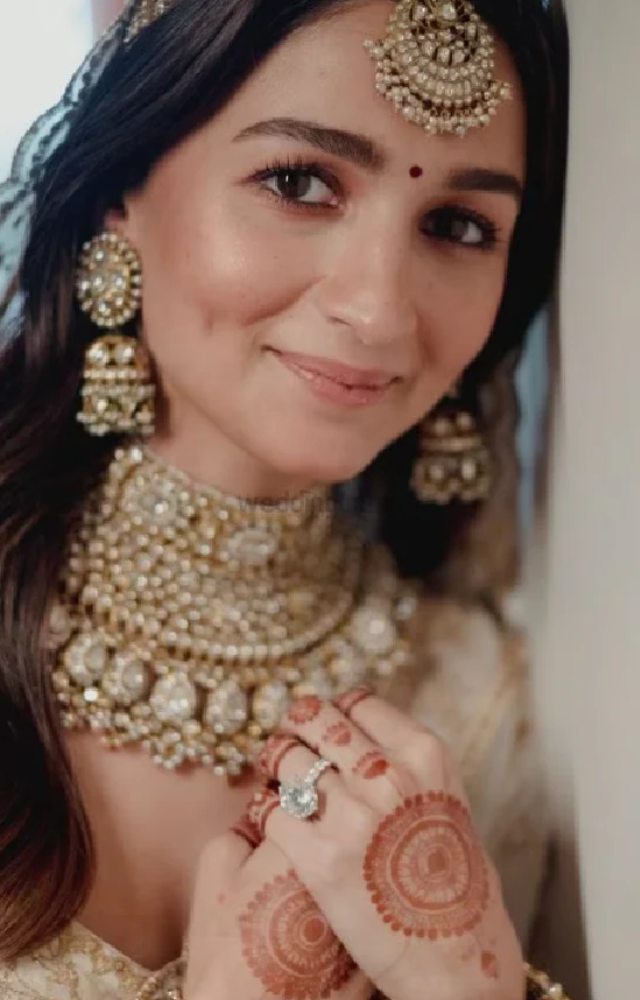 Alia often selects nude lip colors that match her skin tone, enhancing her natural look.