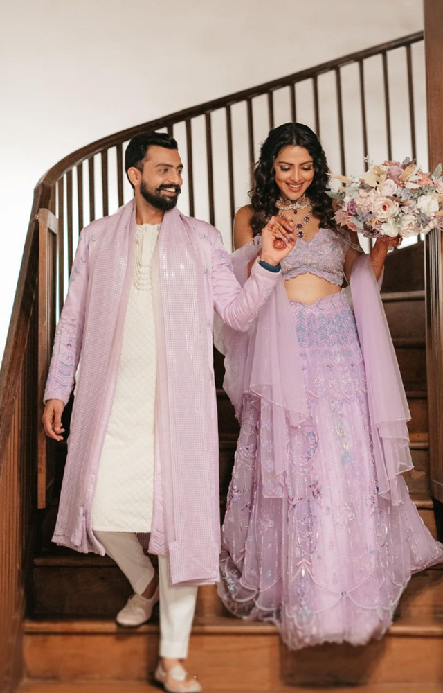Amala Paul radiates in a lavender gown as she walks down the aisle.