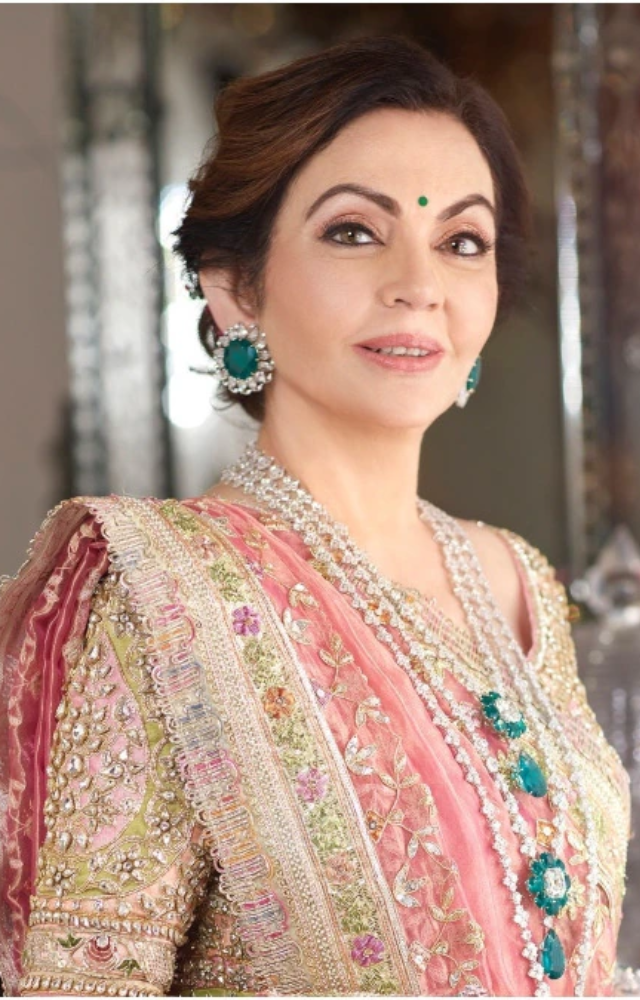 Nita Ambani elegantly donned an ivory Manish Malhotra lehenga with vintage zardosi embroidery and a Banarasi tissue dupatta.