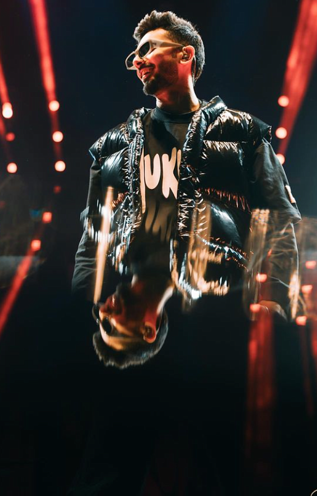 Anirudh often maintains a stylish hairstyle, which adds to his overall appeal. Whether it’s his classic messy hair or a more refined look, he knows how to carry