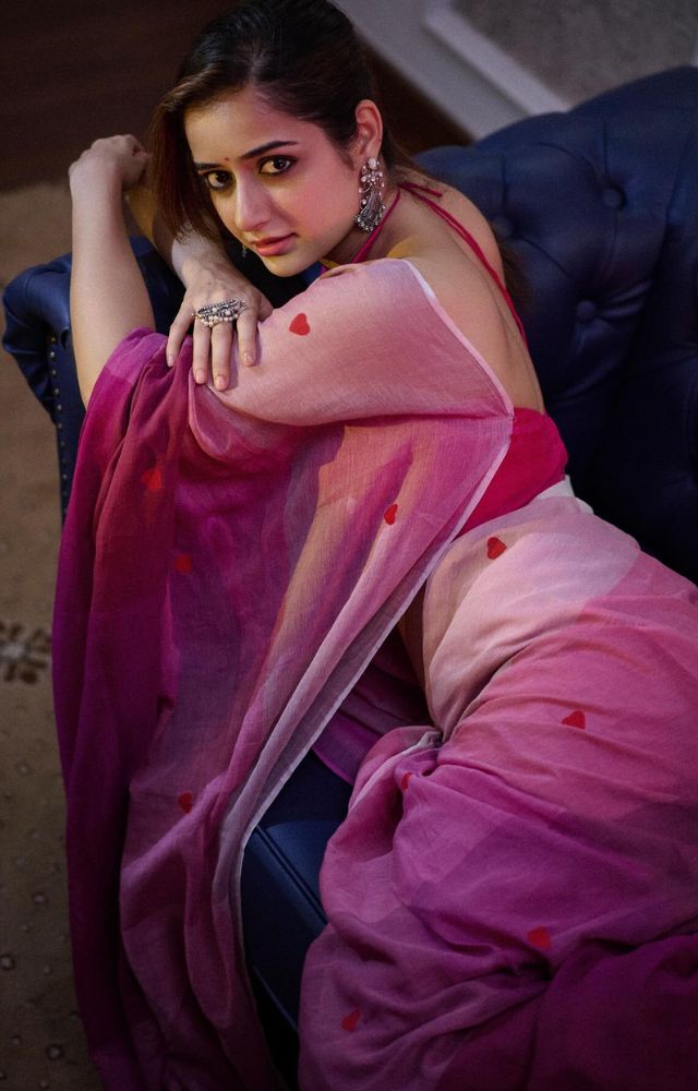 In a pink saree with little hearts, Ashika Ranganath epitomizes timeless elegance and chic fashion sense, as depicted in a stunning photoshoot